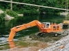 Manapouri Power Scheme, Hitachi UH801 excavating tailrace
